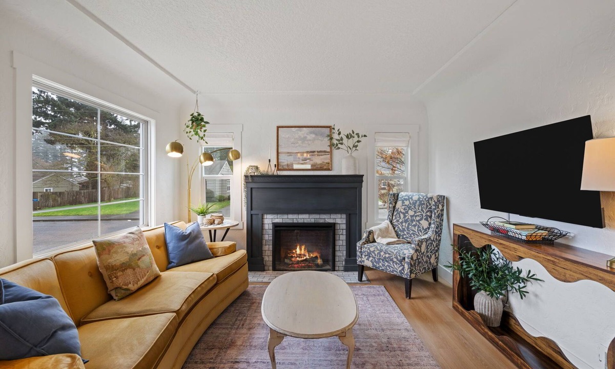 Camas House | Charming Camas home with 3 bedrooms and a shared bath, just minutes from downtown. Relax by the fireplace, enjoy a bright living space, and cook in the updated kitchen. A comfortable spot for families or small groups visiting Camas, WA.