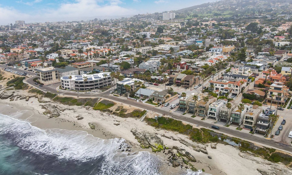 Beach Barber Tract House | Designer Luxury Coastal Home with Panoramic Ocean Views, Rooftop Deck, & Fire Pit