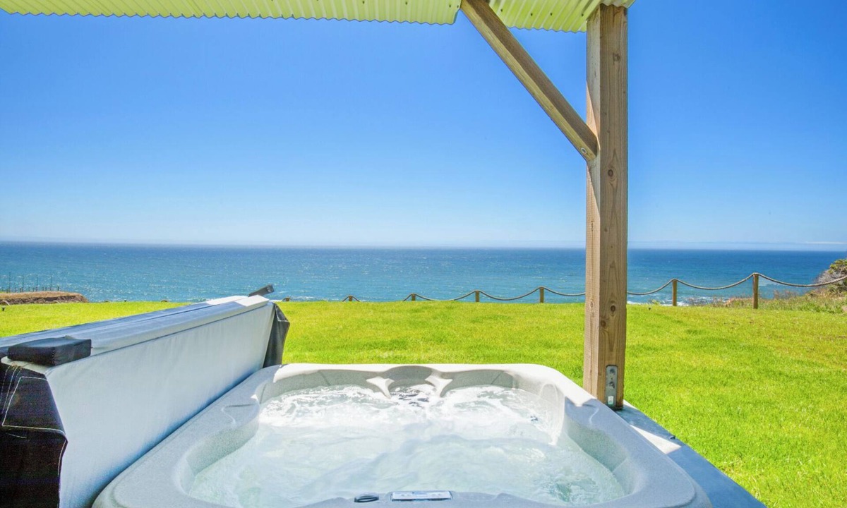 Shelter Cove Condo | Dolphin by OceanviewHotTubs Tesla charging Oceanfront Shelter Cove