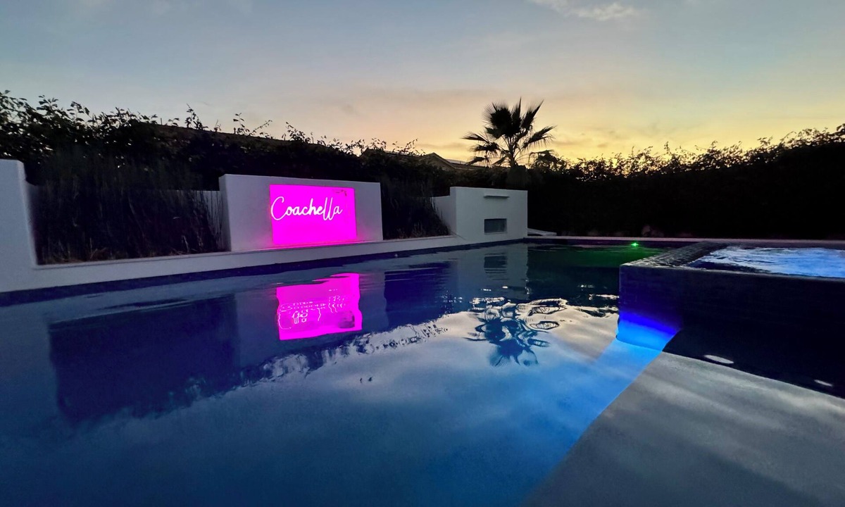 Coachella House | Escape to this newly remodeled 7-bedroom desert retreat designed for relaxation and fun. Enjoy a large resort-style pool and spa, a fully stocked kitchen, spacious game room, and outdoor games perfect for group play under endless blue skies. Whether