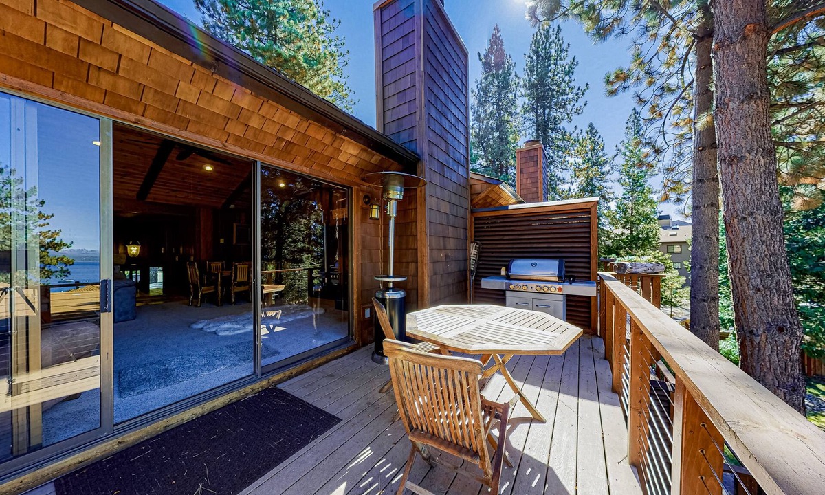 Brockway Condo | Lakeside condo with water views, private beach, dock, buoy, and wood fireplace