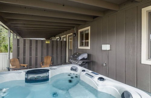 Southeast Bend Condo | 2 Bedrooms, Private Hot Tub, Media Room, Dog friendly with Yard Space. Unit B