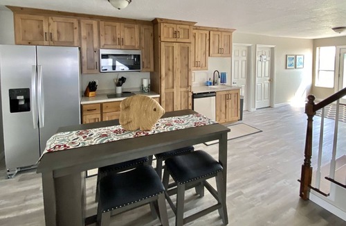 Emery County House | 8 Bedroom 6 Bathroom home with kitchen, dining room area and lounge.