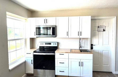 Emery County House | 8 Bedroom 6 Bathroom home with kitchen, dining room area and lounge.