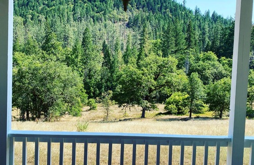 Grants Pass House | Breathtaking home with private historic bridge on a charming creek