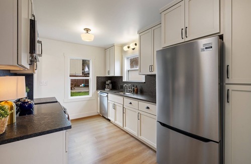 Camas House | Charming Camas home with 3 bedrooms and a shared bath, just minutes from downtown. Relax by the fireplace, enjoy a bright living space, and cook in the updated kitchen. A comfortable spot for families or small groups visiting Camas, WA.