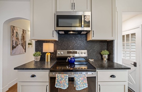 Camas House | Charming Camas home with 3 bedrooms and a shared bath, just minutes from downtown. Relax by the fireplace, enjoy a bright living space, and cook in the updated kitchen. A comfortable spot for families or small groups visiting Camas, WA.