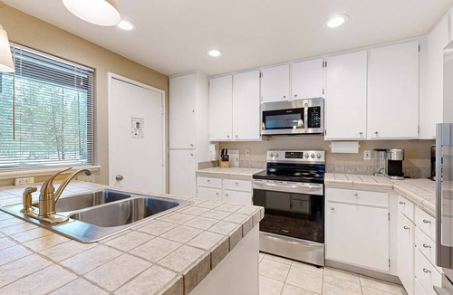 Tennis Village House | Comfortable condo with shared pool, SHARC passes, trails, and more!