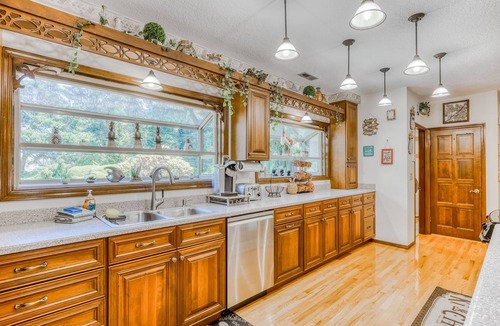 Boring House | Countryside home with private swim spa, fire pit, spacious kitchen, & game room
