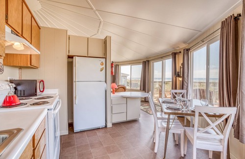 Bayshore House | Cozy Oceanfront Home with Wrap Around Windows! Beach access on the property!