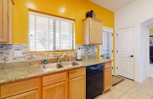 Power Ranch House | Desert oasis with an enclosed yard, firepit, washer/dryer, and central AC
