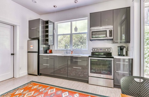 Stevenson House | Dog-friendly studio with river view, patio, grill, & shared W&D