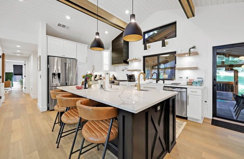 Friendly House | Eugene Evergreen Escape by Les Chalets Stays is a fully renovated home perfect for your crew! Game room, play house, sauna, outdoor entertaining space and huge back yard.