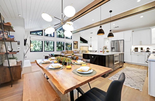 Friendly House | Eugene Evergreen Escape by Les Chalets Stays is a fully renovated home perfect for your crew! Game room, play house, sauna, outdoor entertaining space and huge back yard.