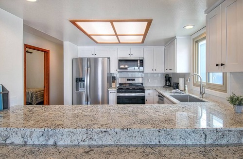 West Newport Condo | Fabulous upper unit on a fabulous street just one house from the beach!