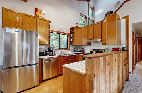 Anchor Bay House | Forested home with fireplace & ev charger near Anchor Bay, dogs welcome