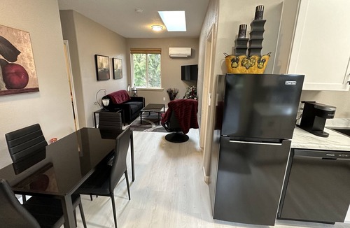 Meadow Glade Cottage | Guest House nestled in the trees with large deck, full kitchen, and laundry