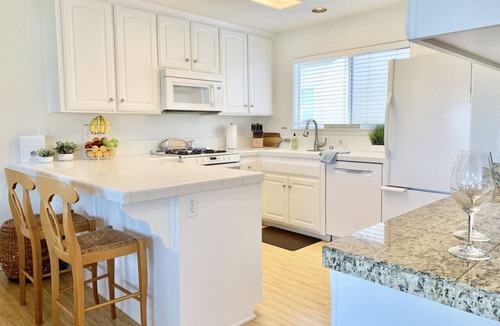 Downtown Condo | Host By Owner! Family Size Condo! Walk to the Beach & Downtown! Two-car garage!