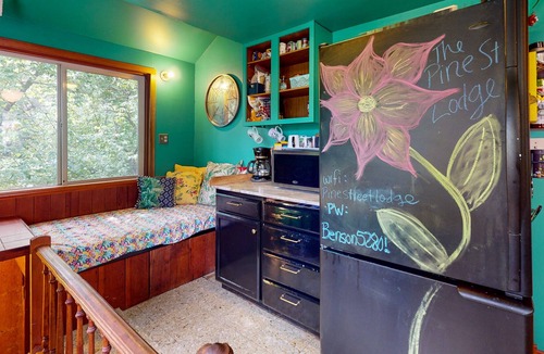 Tigard House | Inviting dog-friendly home with game room, fireplace, balcony, central AC, & W/D