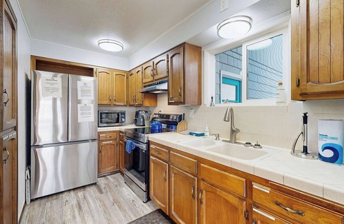 Dunes City House | Lakefront dream with private hot tub, dock, kayaks, pedal boat & amazing views