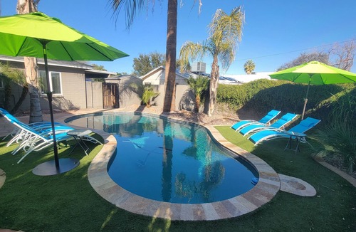 South Scottsdale House | Old Town Scottsdale modern decor big pool hot tub TV on patio Comfort Convenient