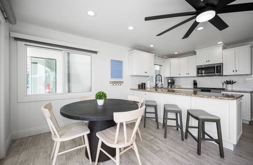 Balboa Peninsula Apartment | Patio on the Boardwalk steps to the Ocean