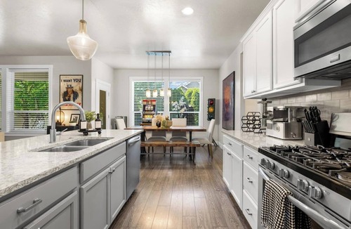 Northwest Boise City House | Relax and recharge at this luxury Boise retreat featuring a private hot tub, sauna, fire pit, game room, and Peloton. Perfect for families, groups, and weekend getaways, this spacious 4-bedroom home comfortably sleeps 9 and is conveniently located.