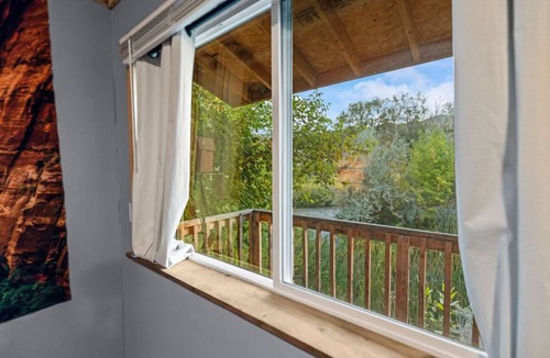 Sevier Cabin | Riverfront cabin with a fitness center and a hot tub