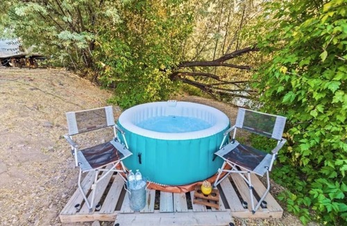 Sevier Cabin | Riverfront cabin with a fitness center and a hot tub
