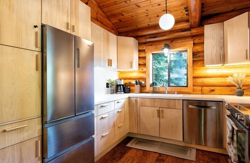 Northwood Cabin | Riverfront luxury cabin, hot tub, private dock, redwoods, ping-pong, foosball
