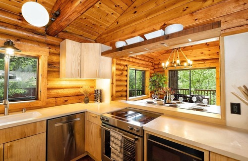 Northwood Cabin | Riverfront luxury cabin, hot tub, private dock, redwoods, ping-pong, foosball