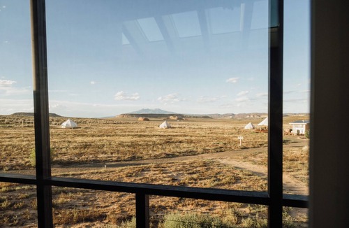 Monticello RV Rental | Solar Powered Casita with 2 beds and a comfy seating area overlooking a peaceful desert setting