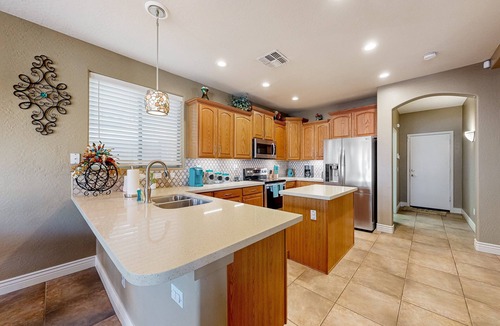 Litchfield Park House | Spacious home surrounded by palms with pool, grill, children's items, & W/D