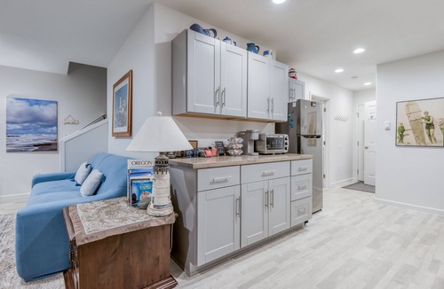 Nelscott House | Steps to the beach, ocean view, deck, BBQ, pet friendly with a fenced in yard