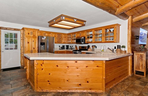 Fox Farm Cabin | The Crazy Bear: Fox Farm! Fenced Backyard! Pet Friendly! Hot Tub! Propane BBQ! Internet! Mountain Decor!
