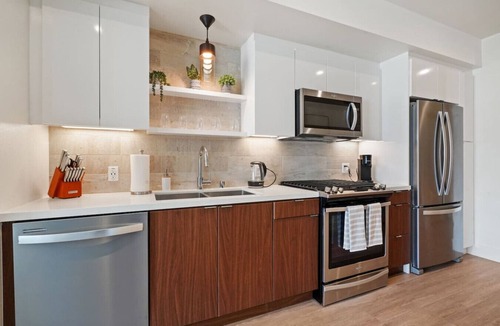 Costa Mesa Apartment | The Savanna - Luxury Condo w Rooftop Pool & Gym!