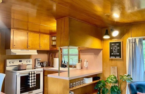 Arroyo Grande Apartment | The Spartan is a fun 1950's vintage trailer under oak trees overlooking a 1 acre organic farm!