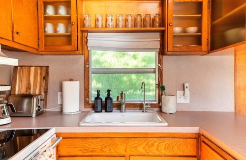 Arroyo Grande Apartment | The Spartan is a fun 1950's vintage trailer under oak trees overlooking a 1 acre organic farm!