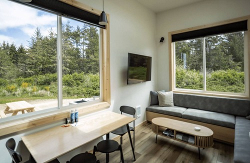 Coos Bay Cabin | Timber Haus w/Loft - Timber Haus, one of our newest (and largest) cabins, is full of light with full windows and skylights. Queen bedroom and upper two-twin loft. Sleeps 4.
