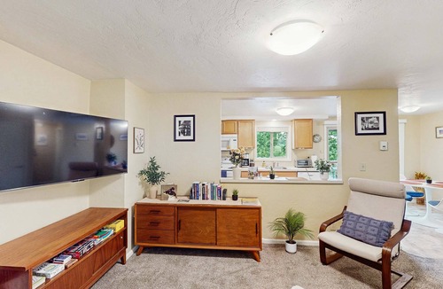 Friendly Condo | Upper level of duplex with a large deck & mountain view - dog friendly for 1 dog