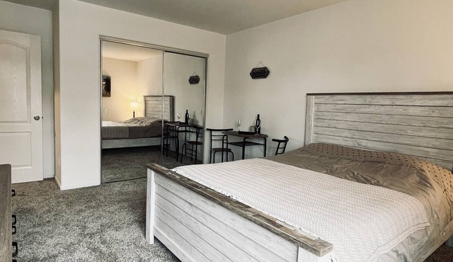 A cozy room with private bathroom and mini kitchen