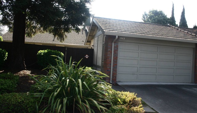 A personal oasis! A single story home in a resort with spacious rooms and yard !