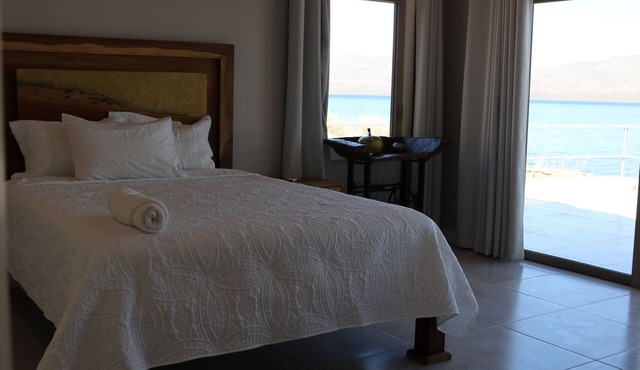 Charming 4-bedroom front beach solar house boat with A/C, in awesome Mulege BCS.
