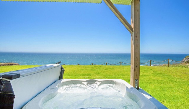 Dolphin by OceanviewHotTubs Tesla charging Oceanfront Shelter Cove