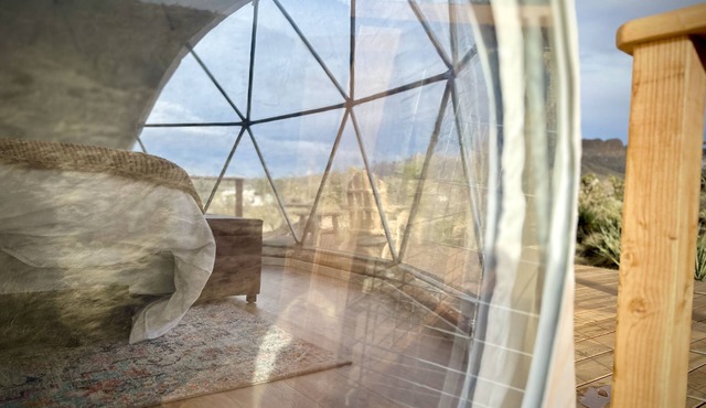 Enchanting Geodesic Dome with Mountain Views and natural desert surroundings.
