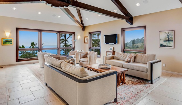 Exquisite home with remarkable ocean views, fireplace & generous patio