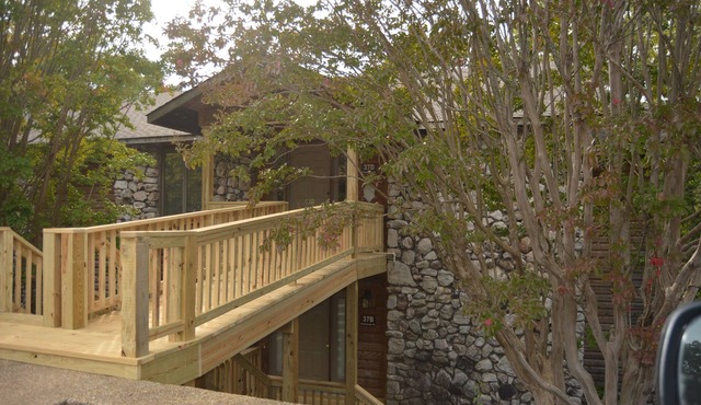Forest view, log-sided two bedroom, two bath condo on Lake Ouachita. by RedAwning