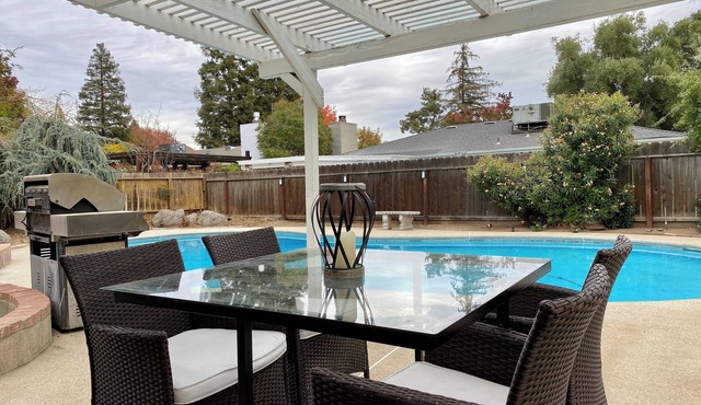 House with a pool next to River Park