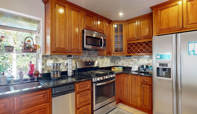 Inviting home with pool, fitness area, fireplace, & W/D