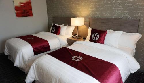 Two-Bedroom Suite with One King Bed and Two Double Beds - Non-Smoking
